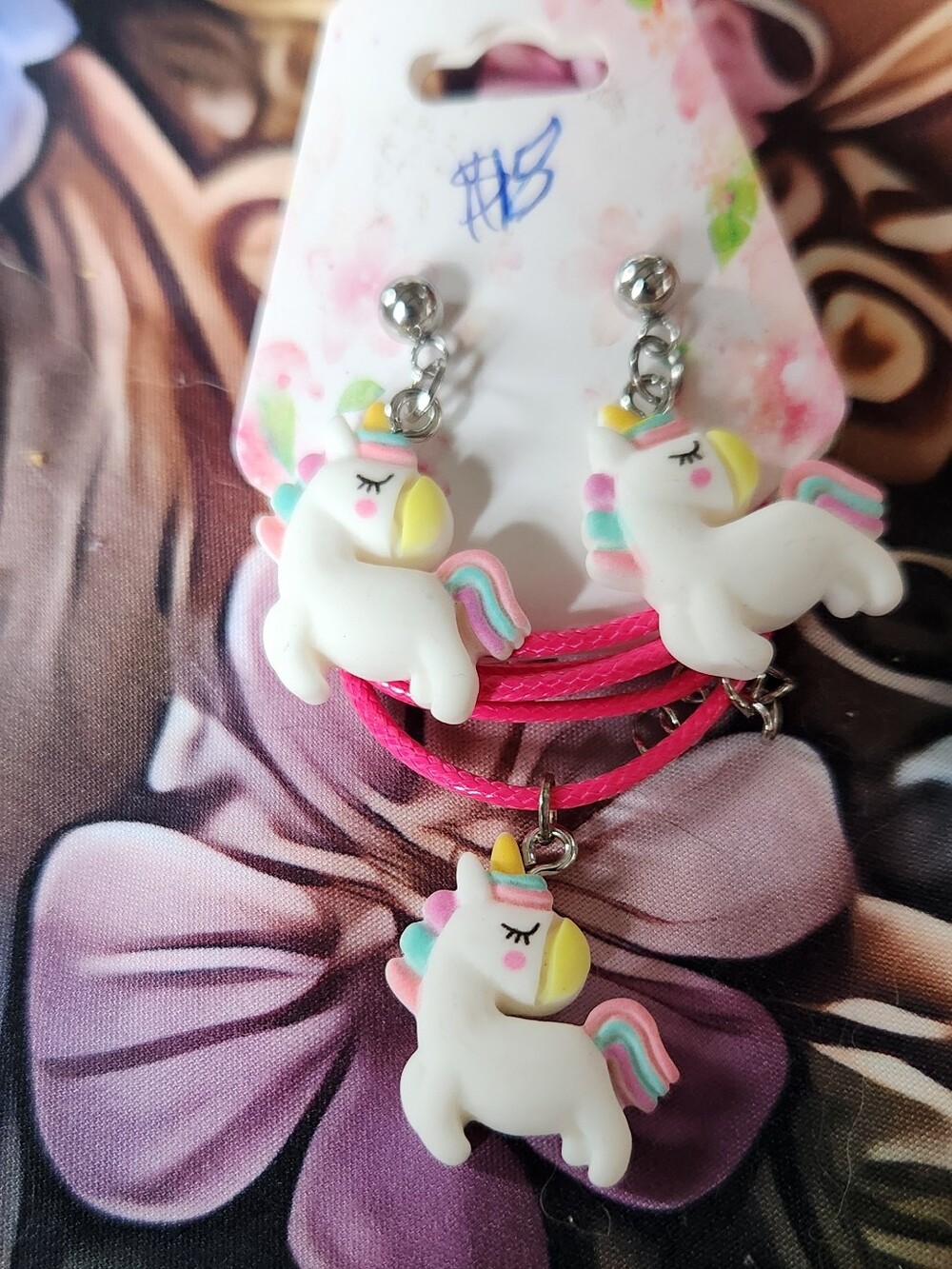 Resin Unicorn Charms On Pink Cord Necklace And Stainless Steel Posts.